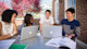 A group of international students studying in an outdoor space at the University of South Carolina.