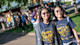 This photo shows two female Asian students standing outside on campus at the University of Wisconsin-Eau Claire