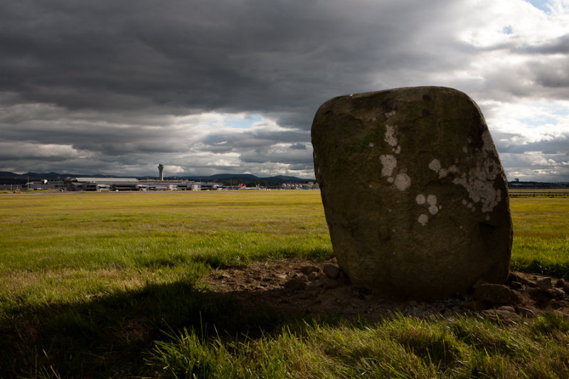 Where can you find a scheduled monument with Roman capitals inscribed on it? On the Edinburgh Airport airfield of course!