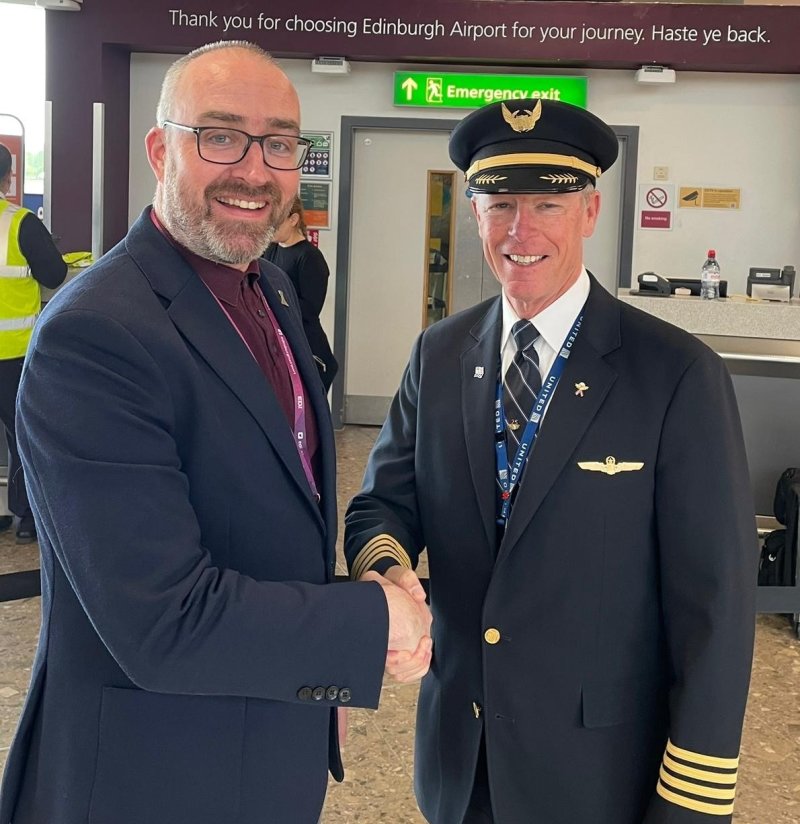 United captain Joe Fox with Gordon Robertson, Edinburgh Airport