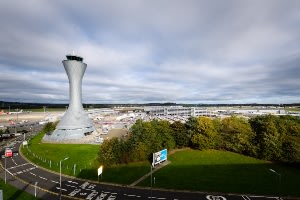 When should I arrive at Edinburgh Airport for my flight? 