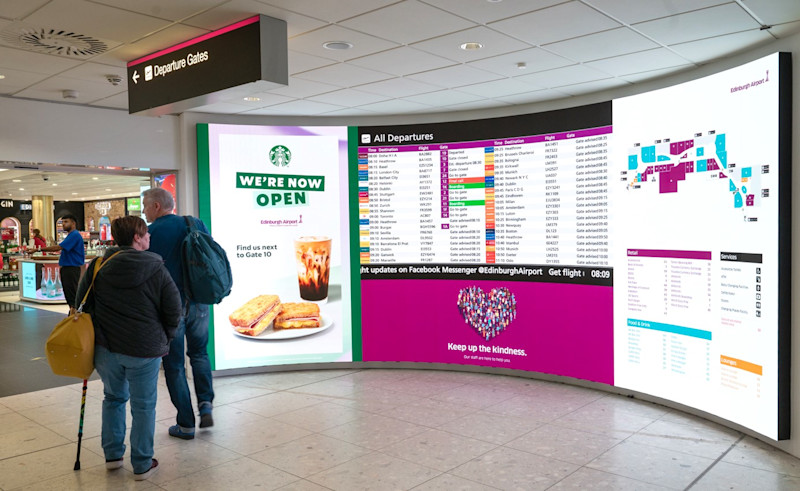 Flight information display screens (FIDS) before entrance to World Duty Free
