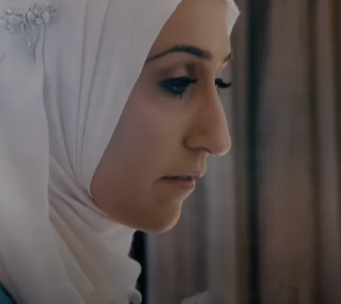 Sam Latif, Procter & Gamble Inclusive Design Consultant photographed from the side. She is wearing a white hijab.