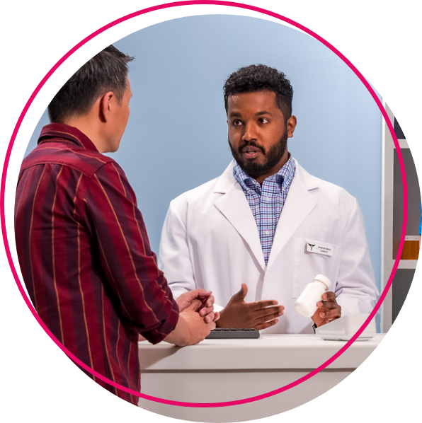 A pharmacist speaking with a patient about their prescription