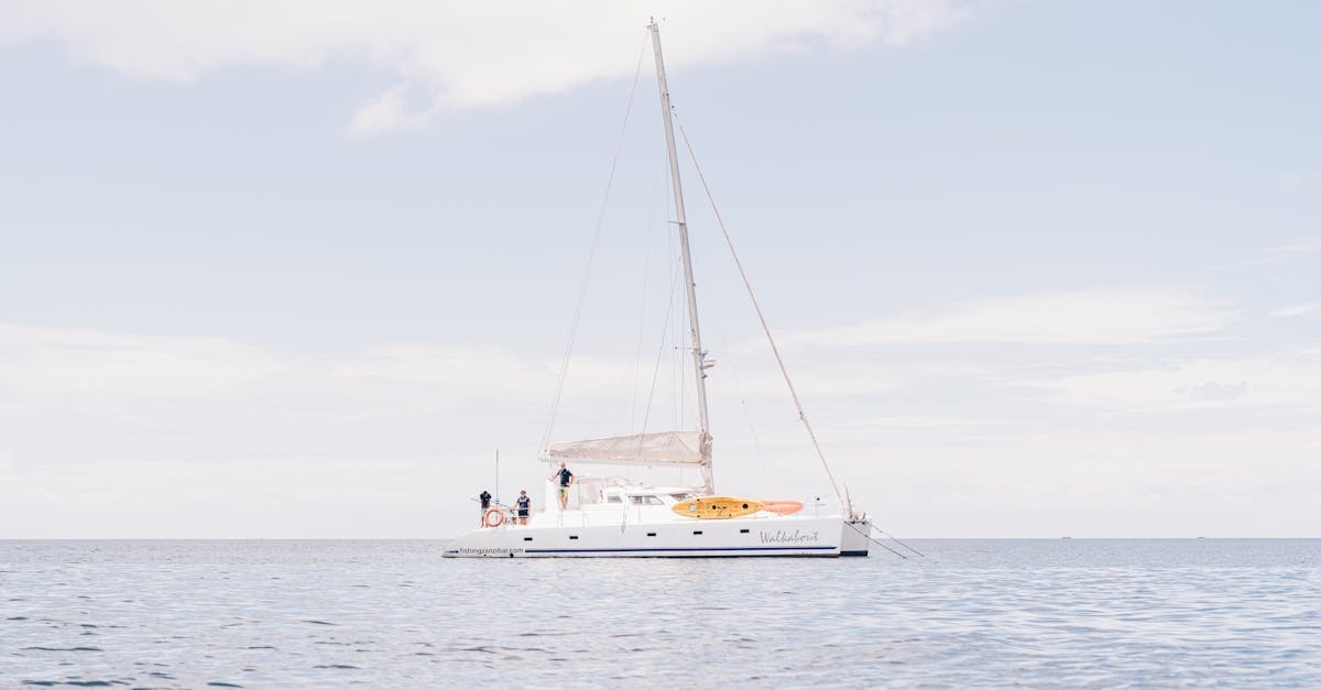 White Boat On Sea Under White Sky