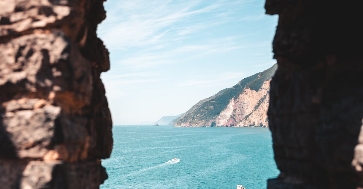Brown Rock Formation Near Body of Water