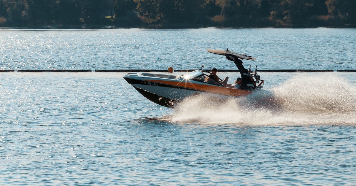 Person Driving Black and Orange Speedboat