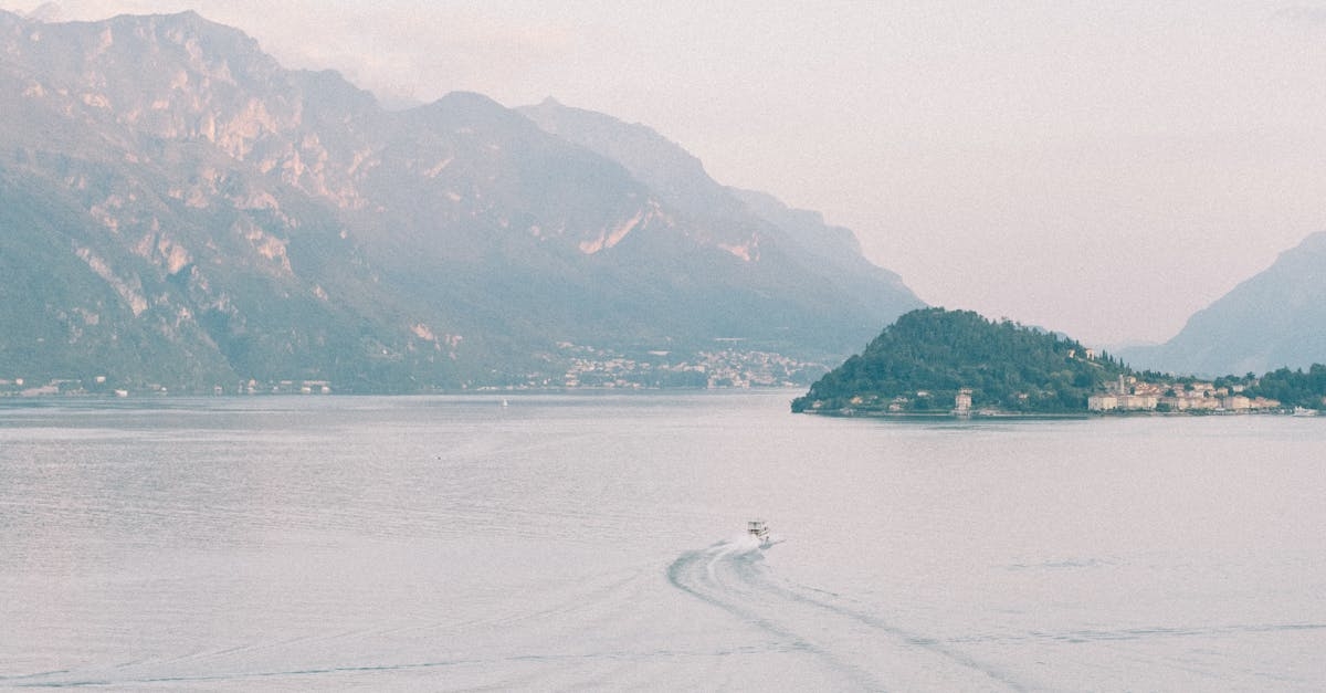 Aerial View of a Hotel and Lake Como with Mountains in the Background