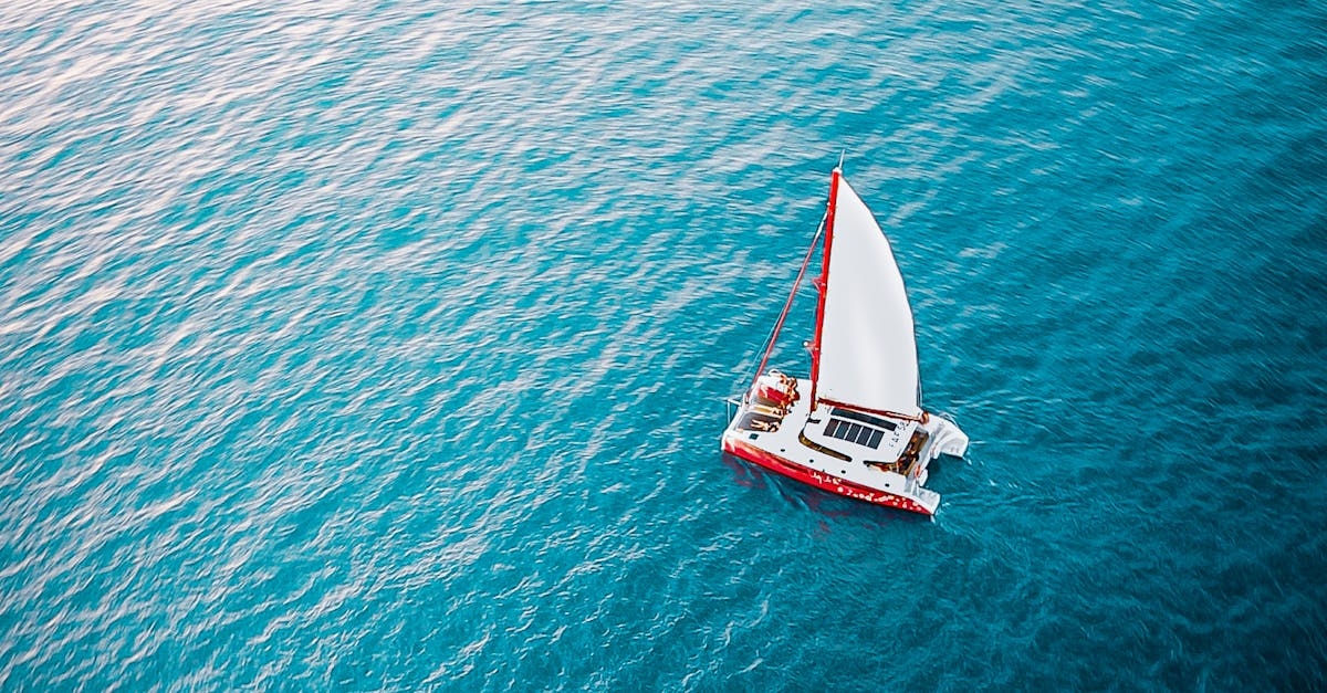 Sailboat floating on rippling sea