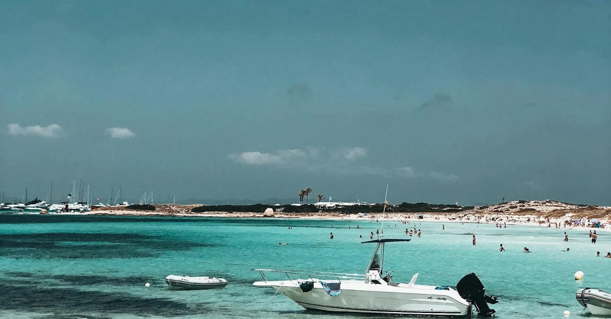 White Motorboat on Body of Water