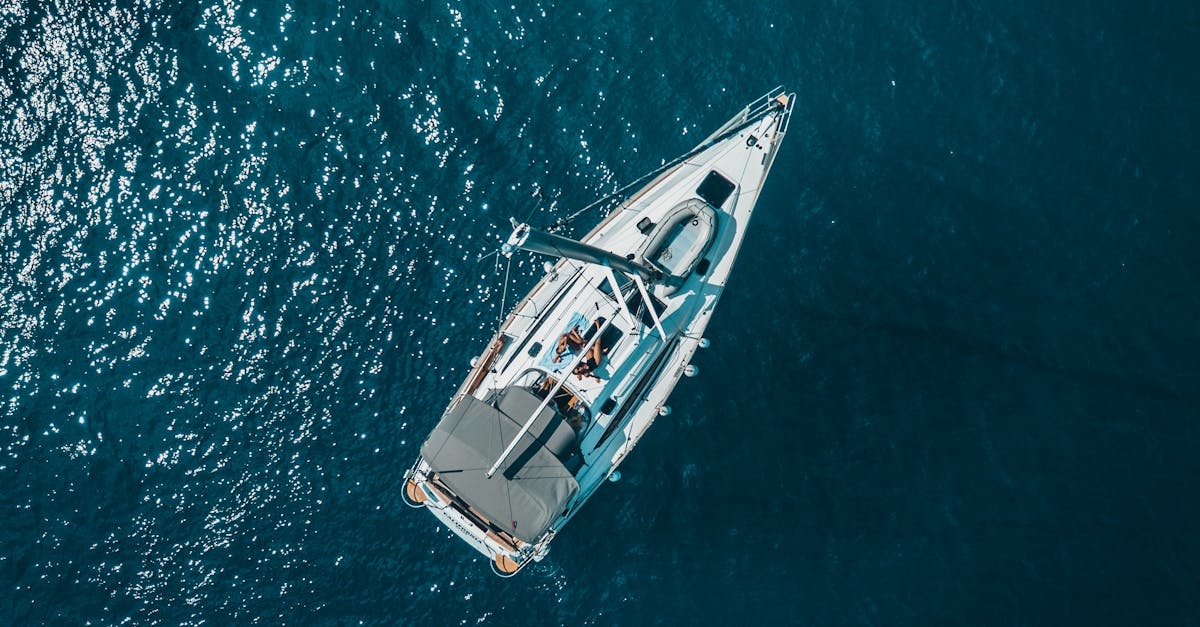High Angle Photo of White Boat on Body of Water
