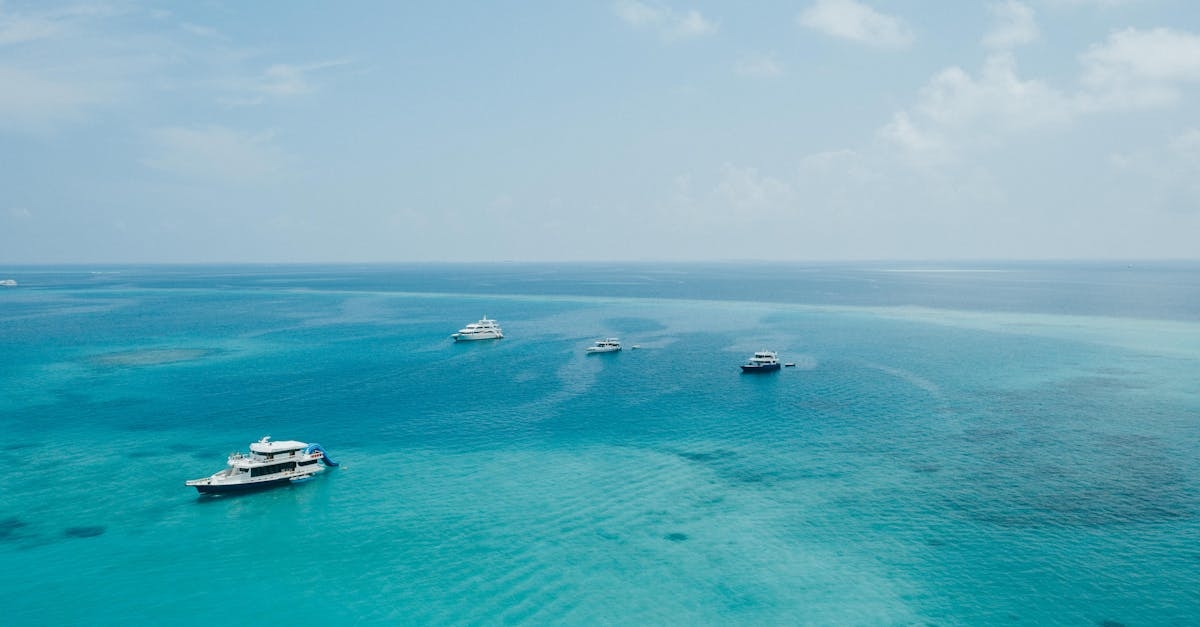 Modern yachts floating on azure seawater