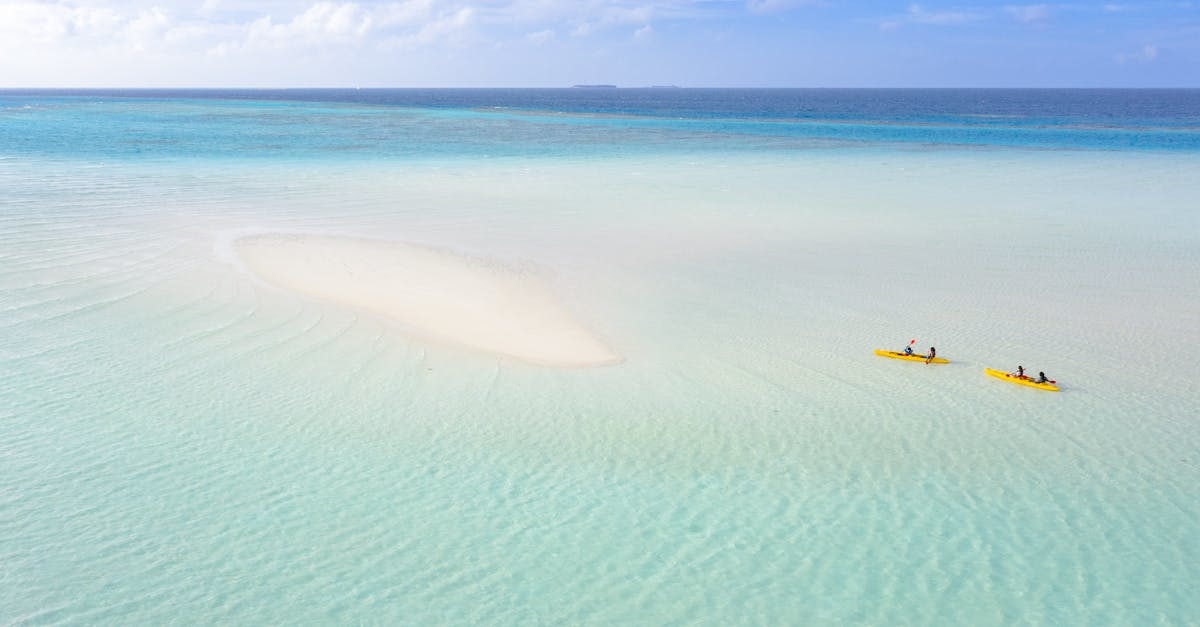 Aerial View of Yellow Boat on Sea