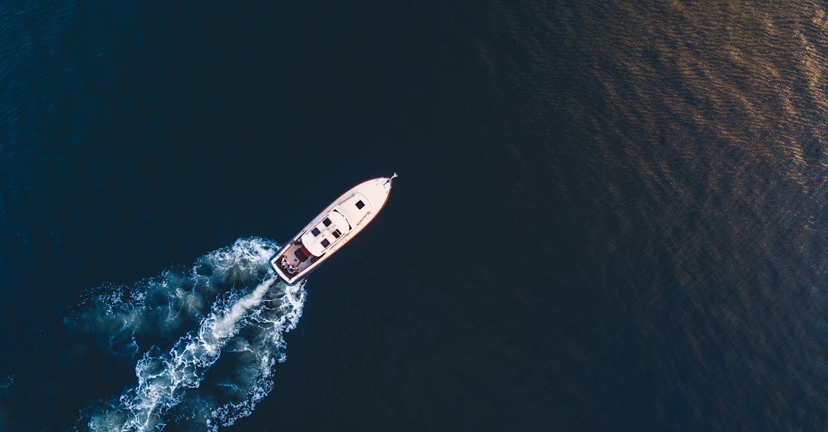 An Aerial Shot of a Boat Sailing on the Sea