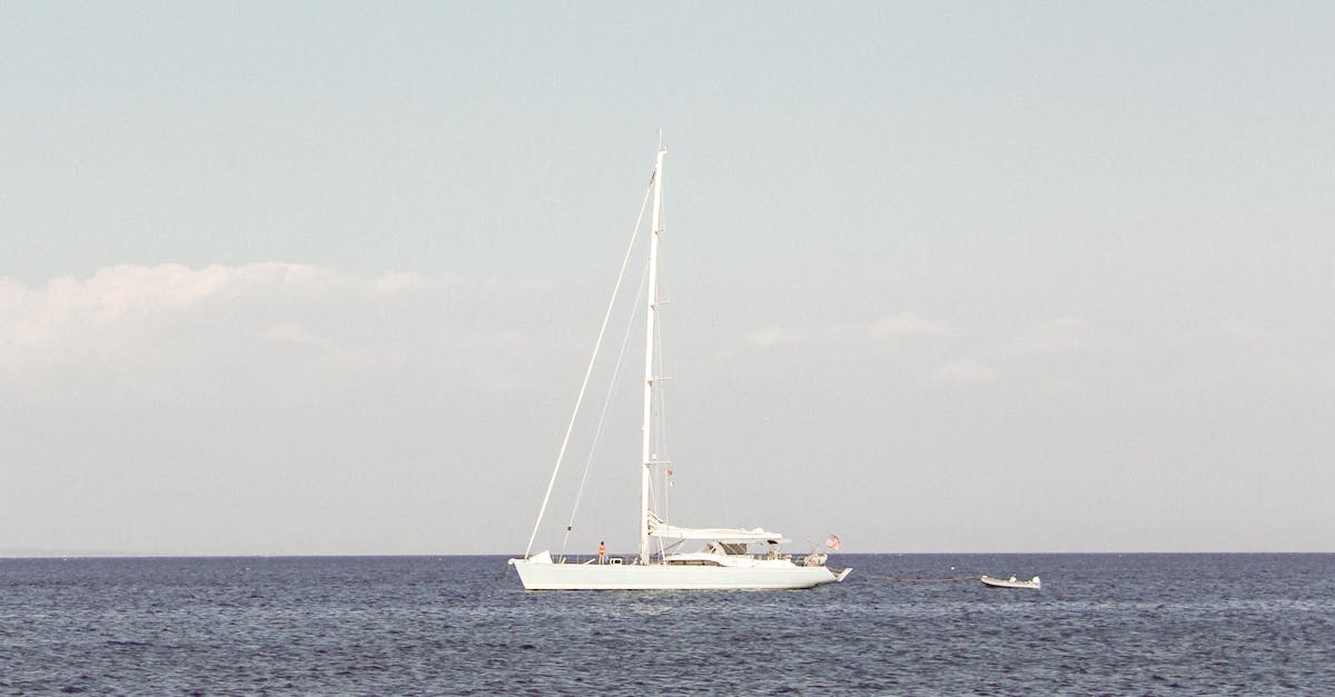 White Yacht on Sea Under Blue Sky