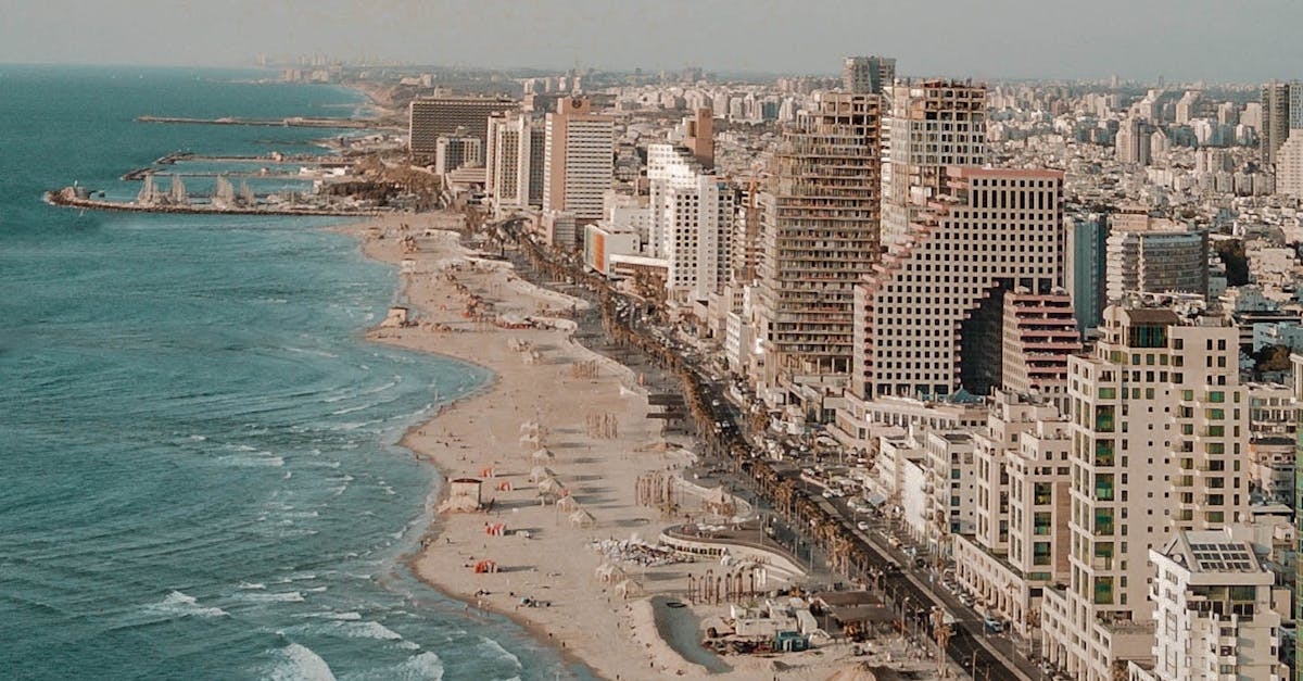 Aerial Photo of Road Near Buildings and Beach