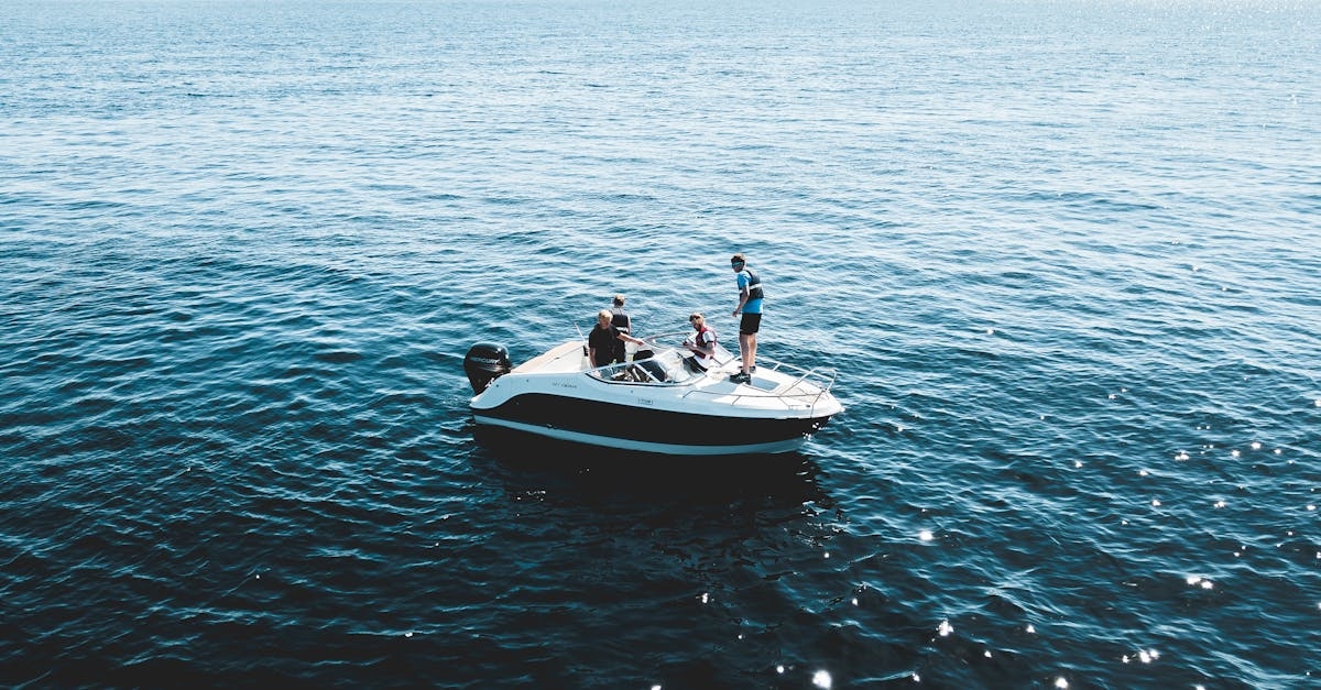 Three Person on White Motorboat at Daytime