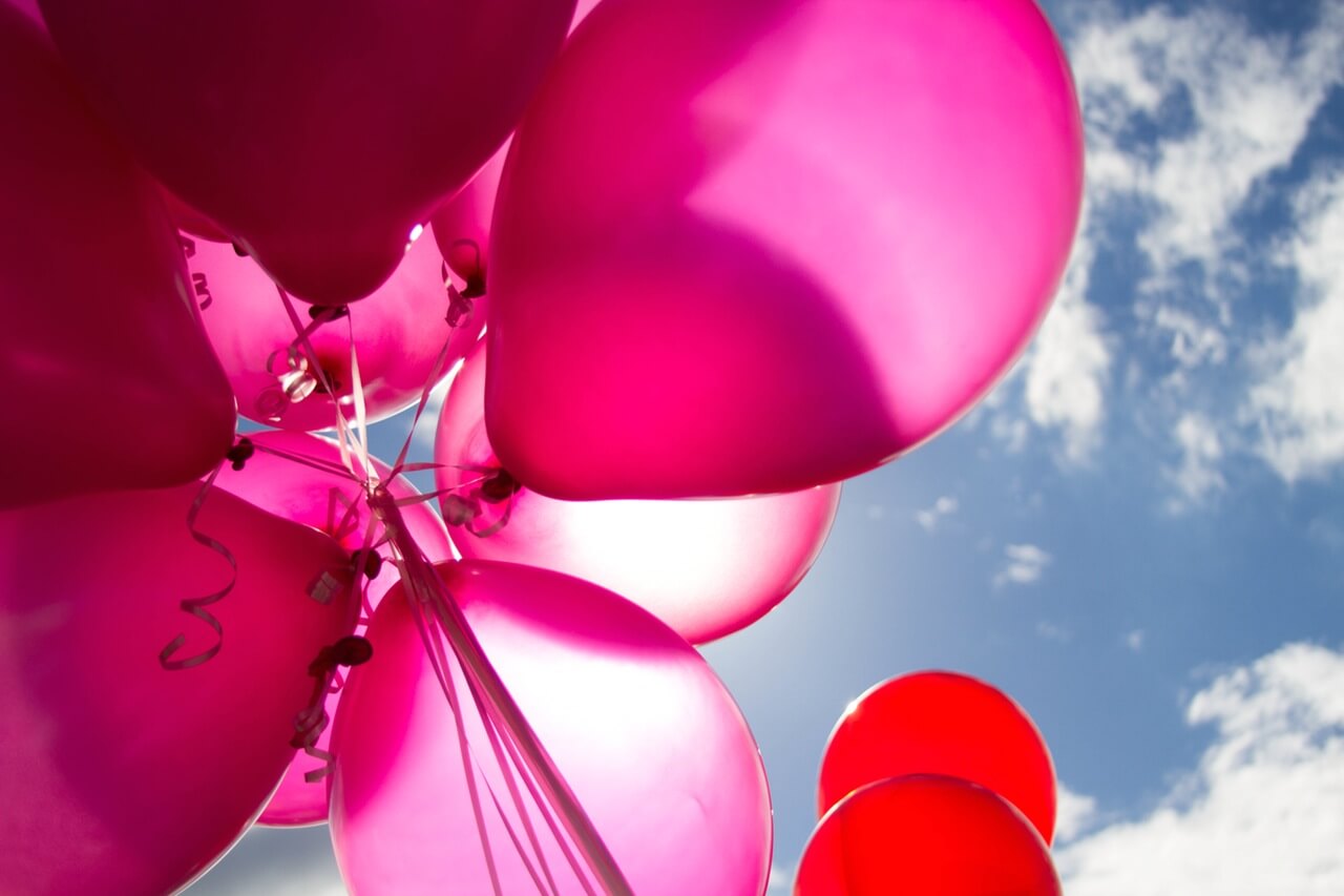 pink balloons in the sky