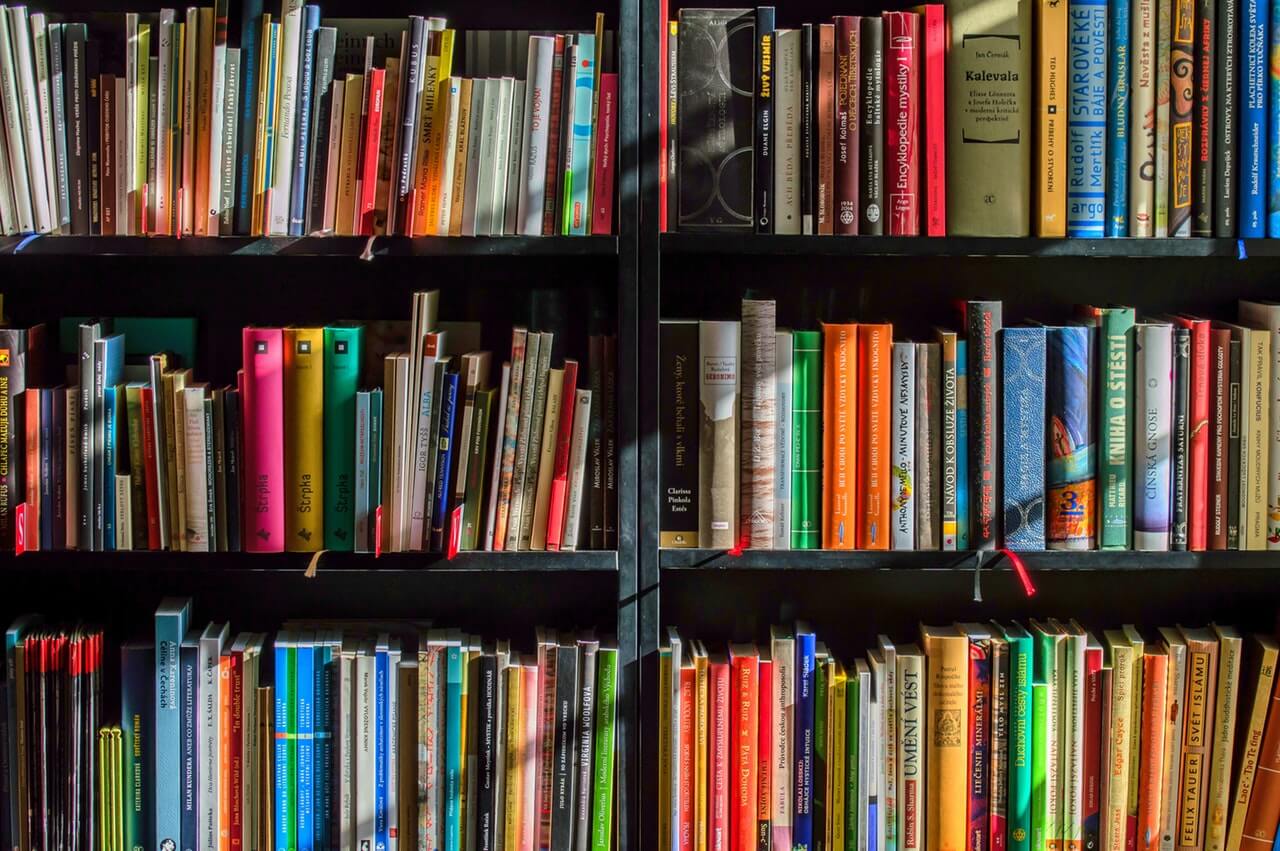 stack of books on bookshelf