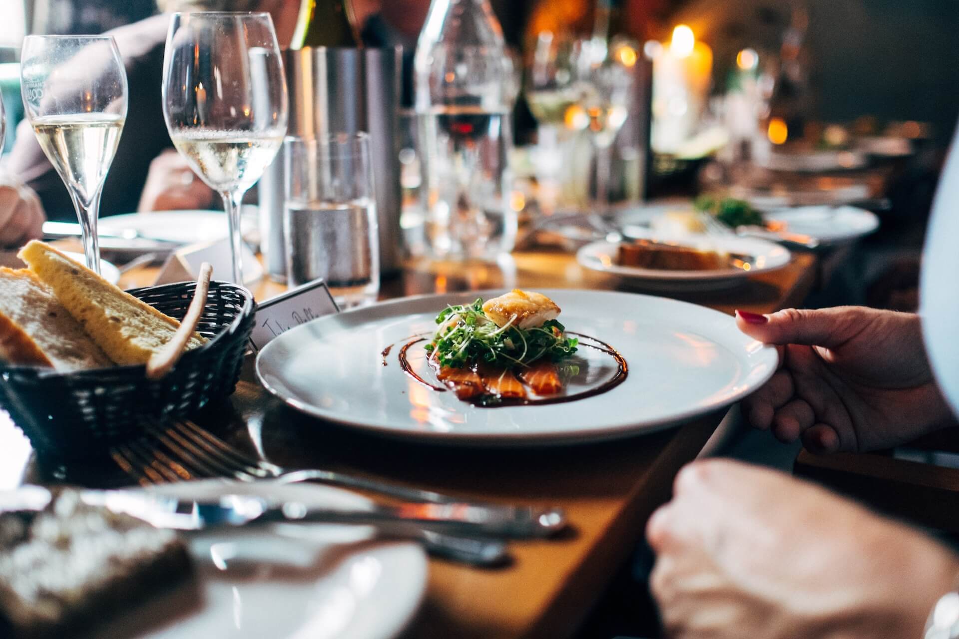 Friends eating food at a table