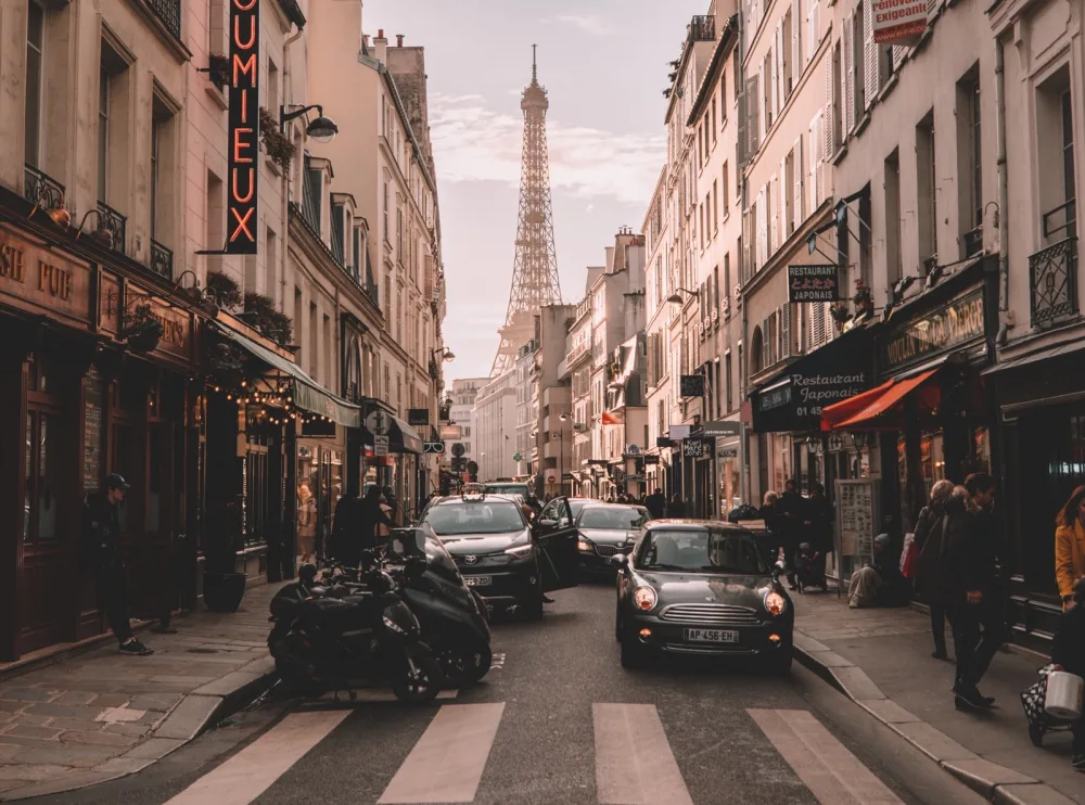 narrow-street-in-paris-with-cars-on-road