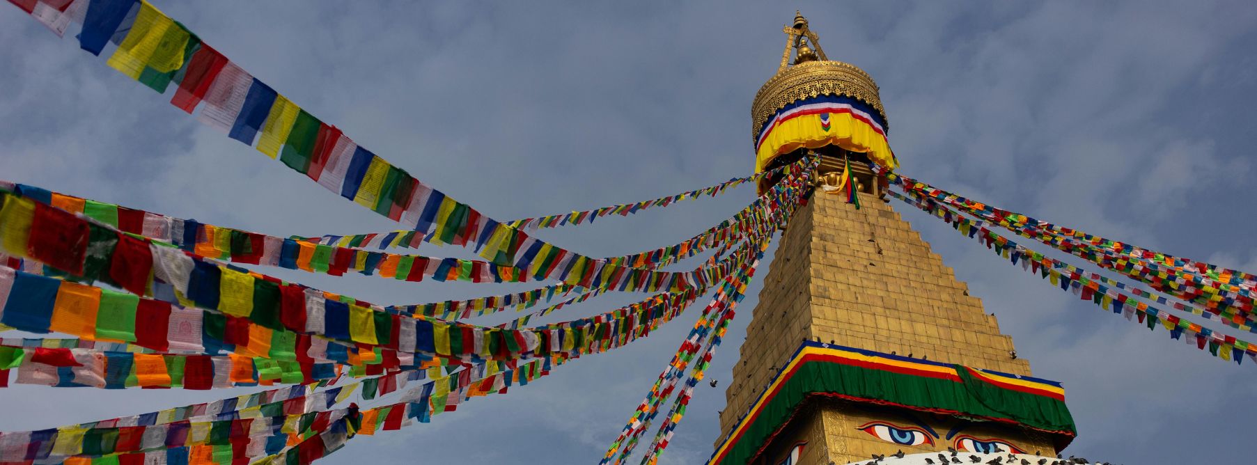 A picture of the Tower of the Boudhanath Stupa, the perfect place to practice Nepali language