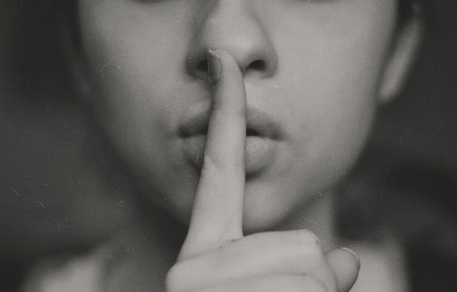 finger-over-lips-as-secret