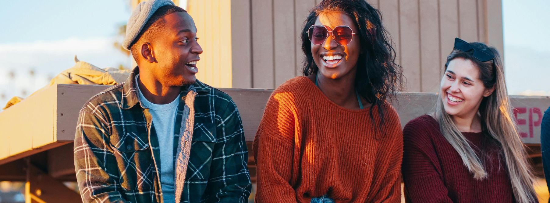 a man speaking with two native Portuguese speakers 