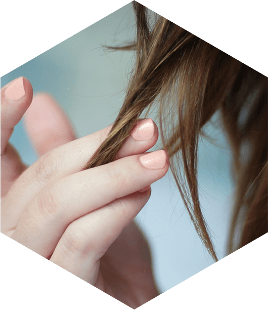 Woman with hair loss touching hair