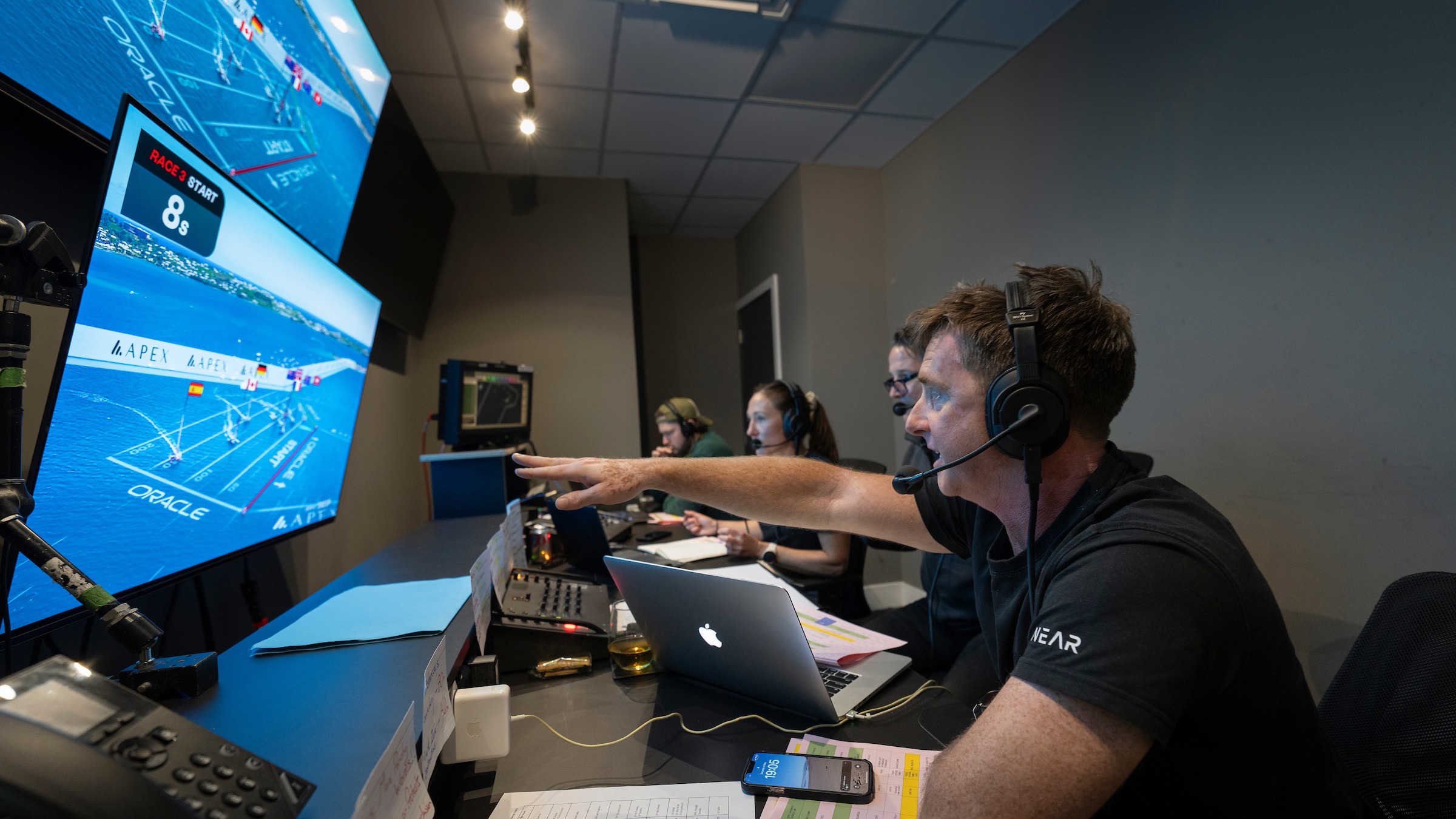 Season 4 // Stevie Morrison points to screen while commentating Bermuda