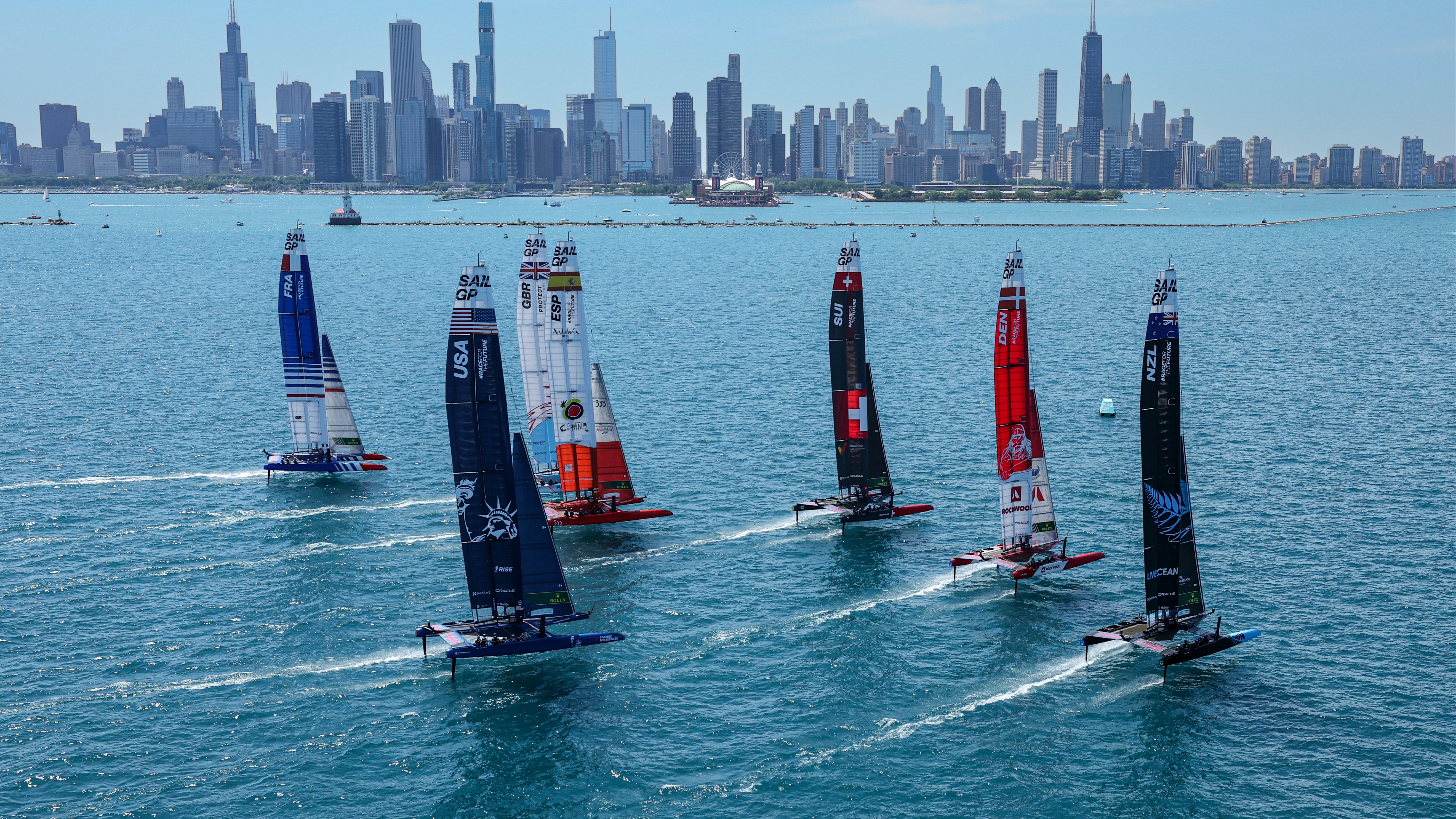 Season 3 // United States Sail Grand Prix Chicago // Fleet head towards city skyline 