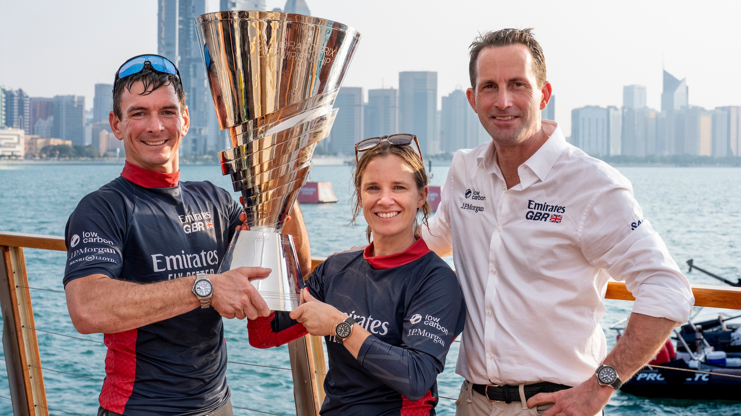 2025 Season // Dylan Fletcher, Hannah Mills, Ben Ainslie with the Rolex SailGP trophy