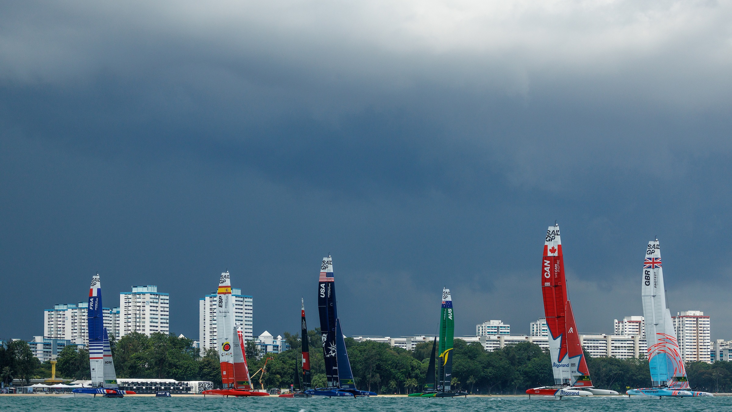 Season 3 // Singapore Sail Grand Prix // Fleet underneath stormy sky 