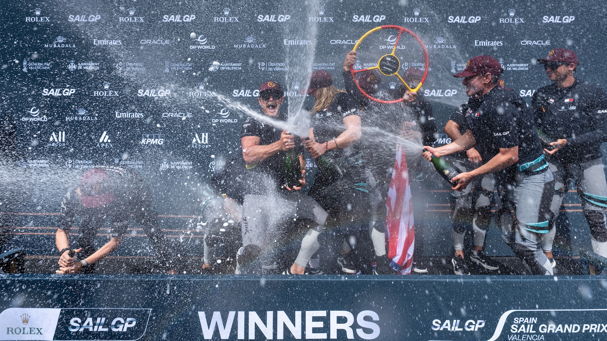 2026 Season // The US SailGP Team celebrate their Valencia win on the podium
