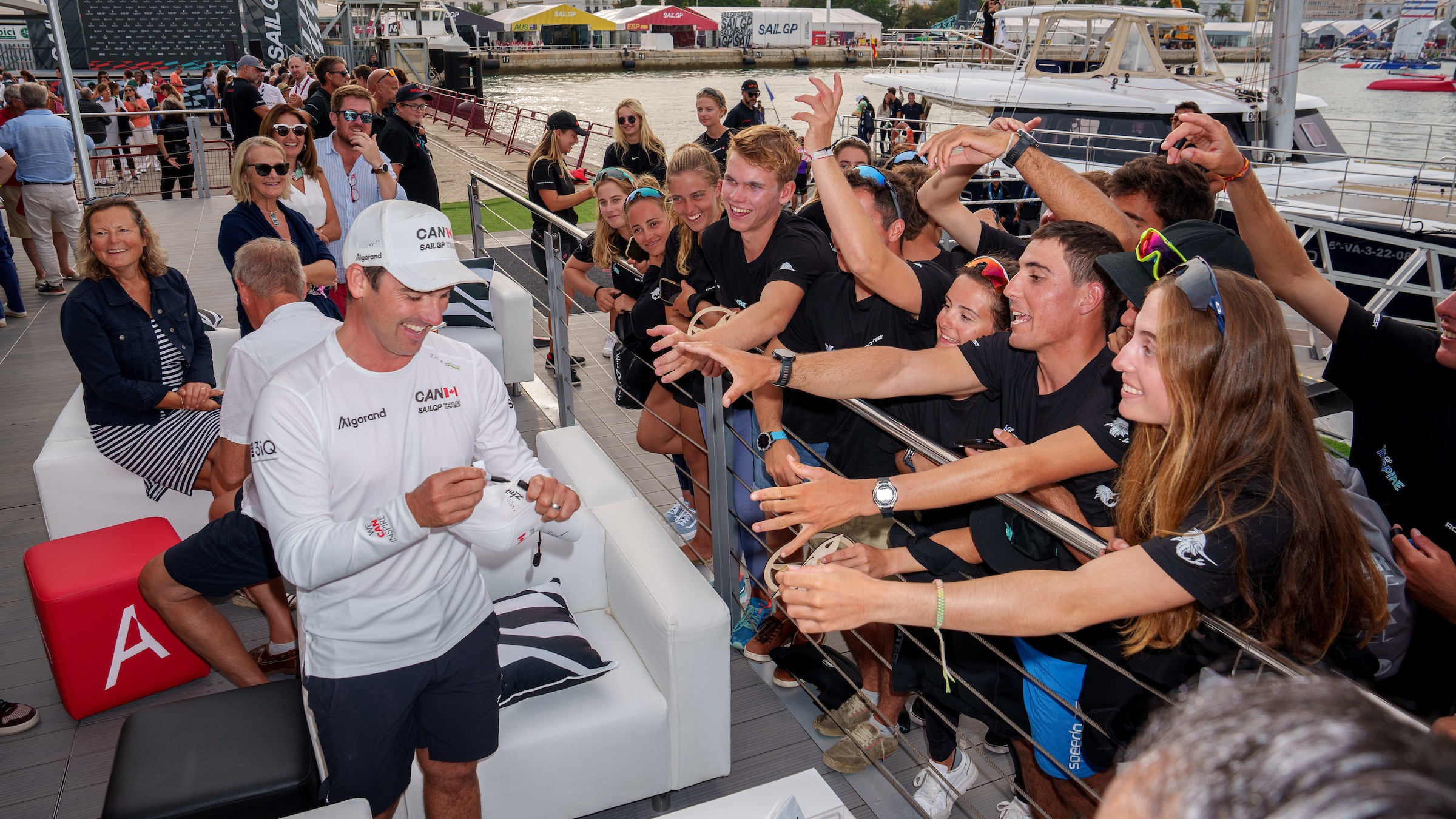 Season 3 // Spain Sail Grand Prix // Phil Robertson signs autographs for Inspire sailors