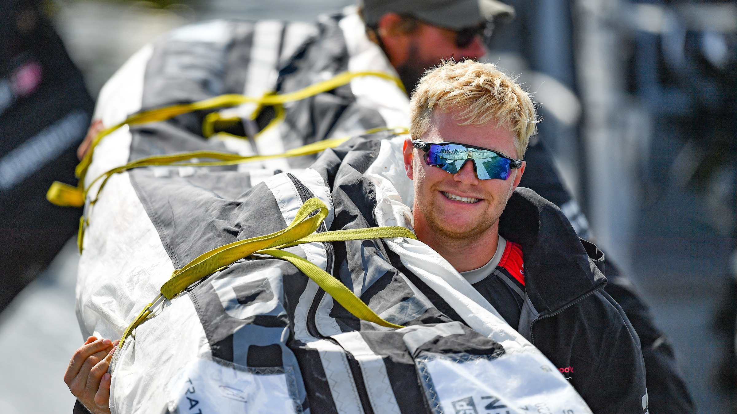 Season 3 // Denmark SailGP Team // Grinder Hans-Christian Rosendahl carries the jib ashore