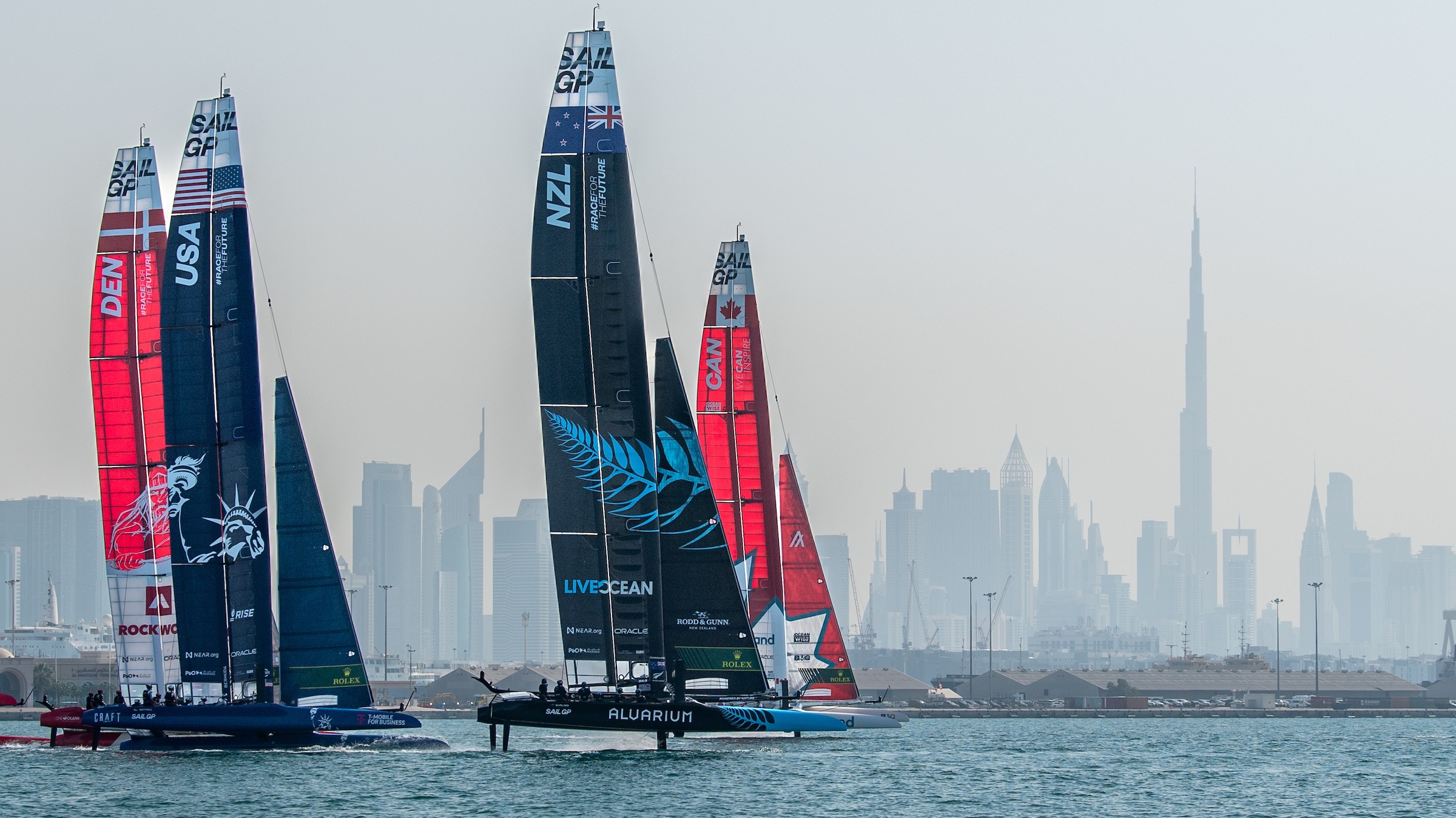 Season 3 // Dubai Sail Grand Prix // NZL, CAN, USA and DEN against city skyline 