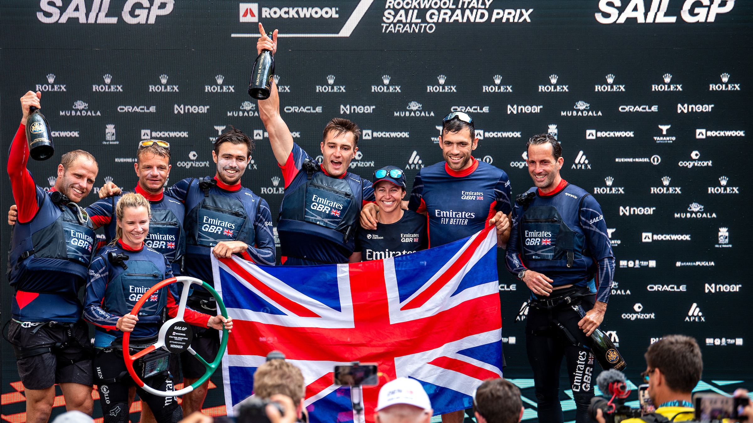 Season 4 // Emirates GBR crew celebrate with Union Flag after racing in Taranto