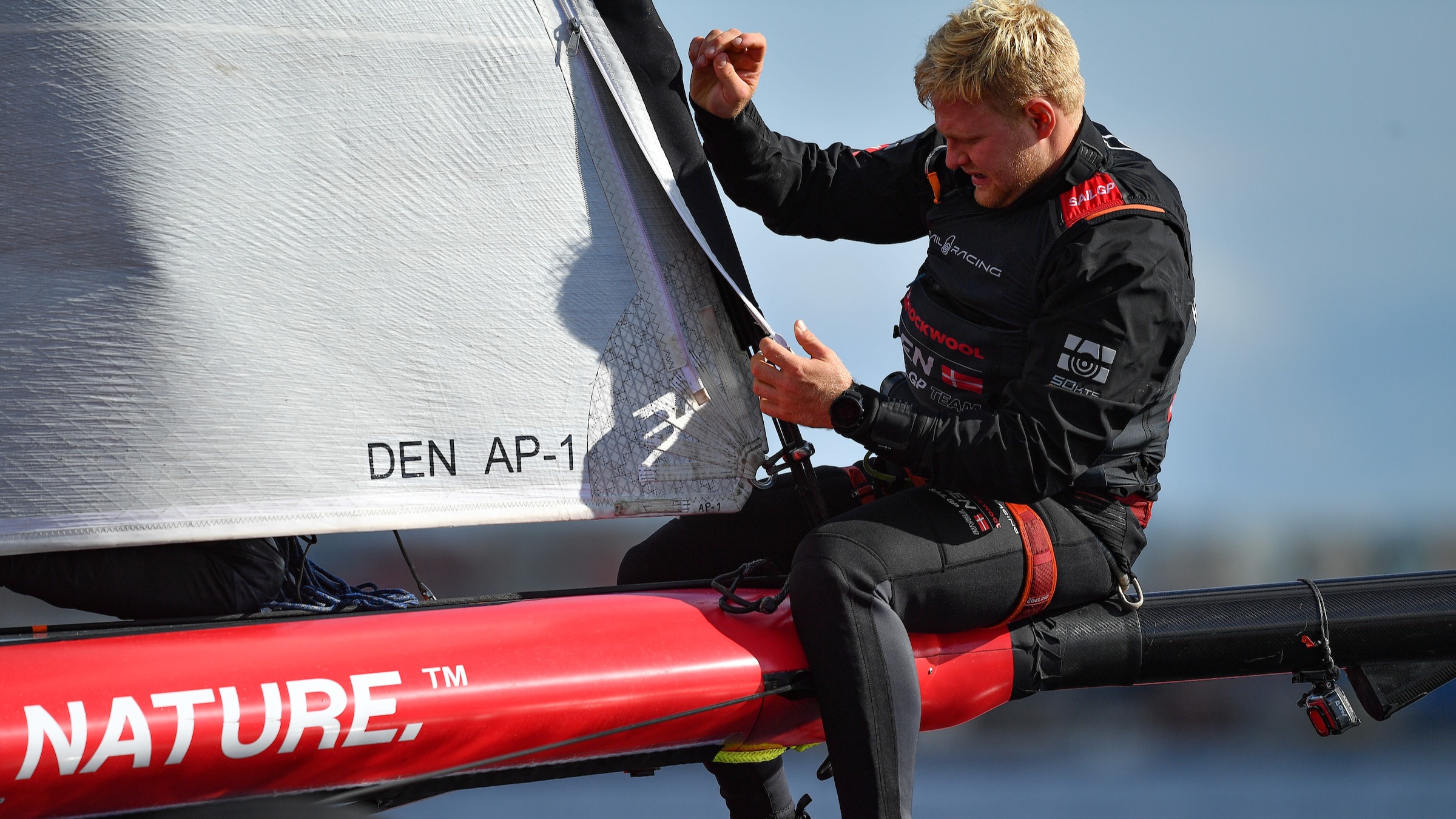 Season 3 // Denmark SailGP Team // Grinder Hans-Christian Rosendahl inspects the sail