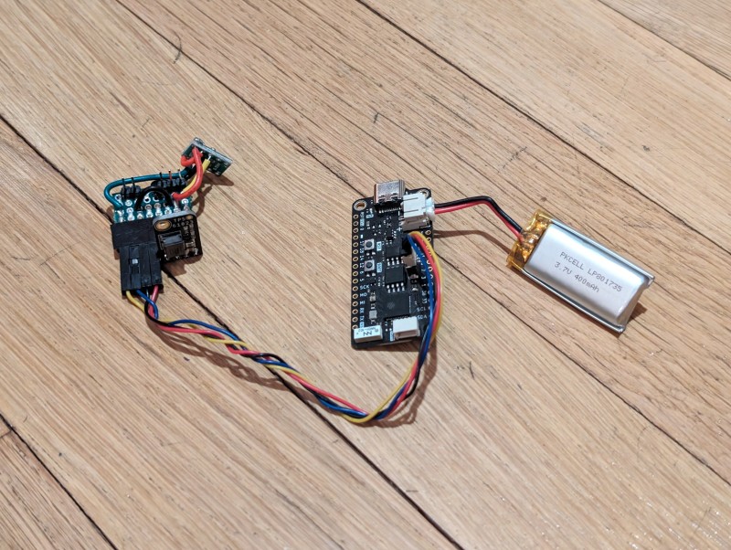The flag raises when you’ve got mail; it’s activated by a small servo, powered by an Adafruit MiniBoost 5 V