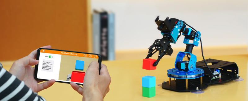 A smartphone app enables manual remote control and an array of fun AI modes such as block-stacking