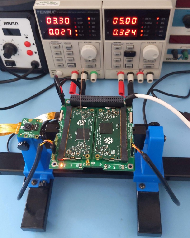 Raspberry Pi Compute Modules being tested. In use, an embedded microcontroller continuously monitors the system state of health to detect hardware faults