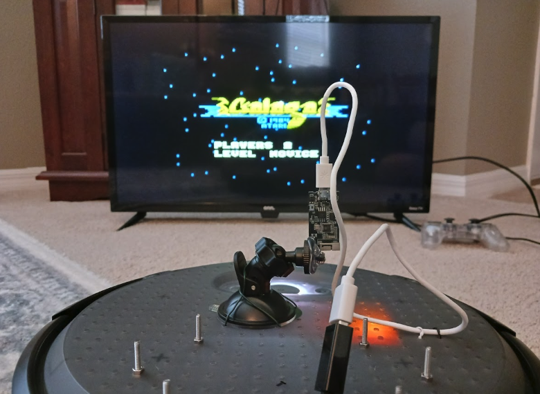 This robot plays Galaga for you – with your guidance