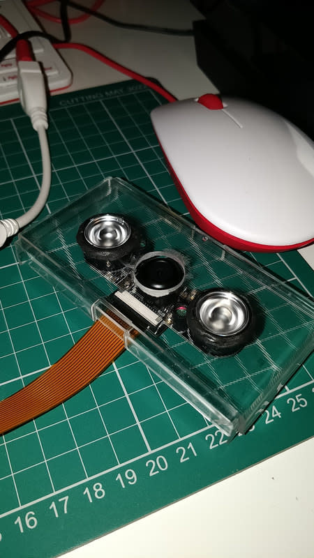The ZeroCam and its IR LEDs were mounted in drilled holes of a piece of clear plastic and secured with Sugru