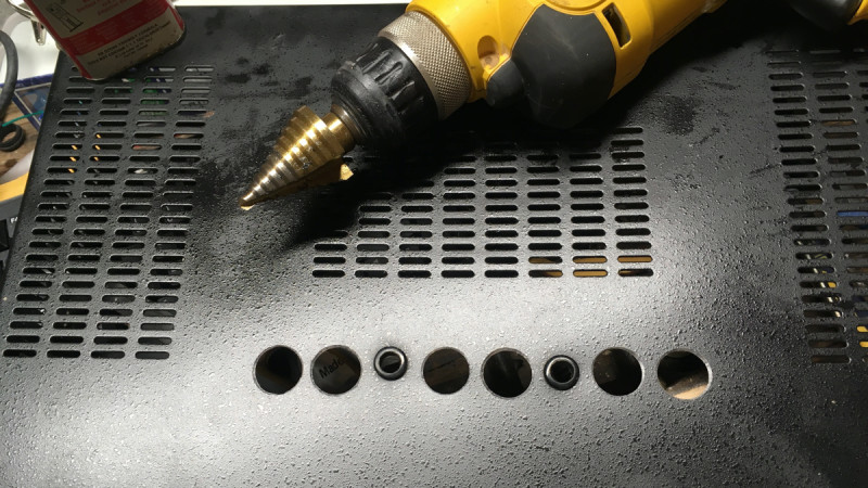 Step drill bits are great for making holes in thin material
