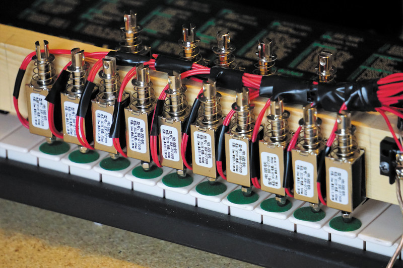 Mounted on a wooden frame, the solenoids respond quickly and can be triggered simultaneously to play chords