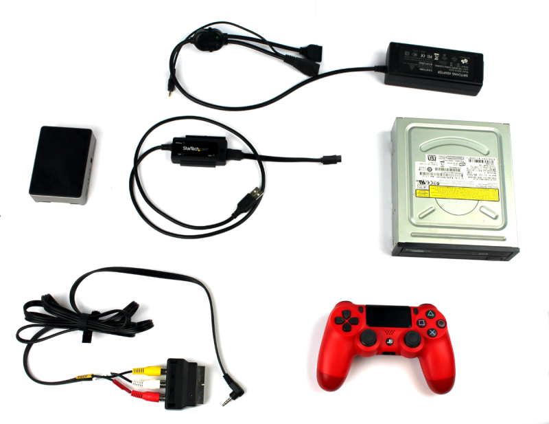 This build included an internal PC DVD-ROM drive, an externally powered SATA- to-USB adapter, a composite video out cable and SCART adapter, a heat-sink case, and controller