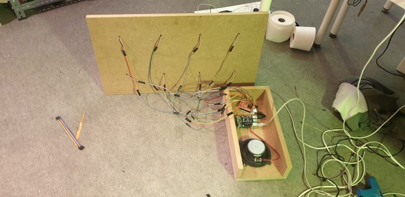 Raspberry Pi, HiFiBerry AMP, and speaker are placed in a wooden box, along with an Arduino Mega connected to the sensors