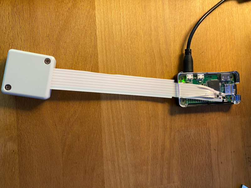 Wires from the encased sensor are soldered to Raspberry Pi Zero. The maker wants to add a door sensor, too, for speedier alerts