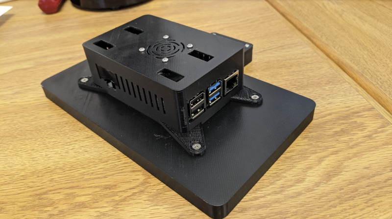 The 3D-printed case is quite simple, and easy to mount on a wall